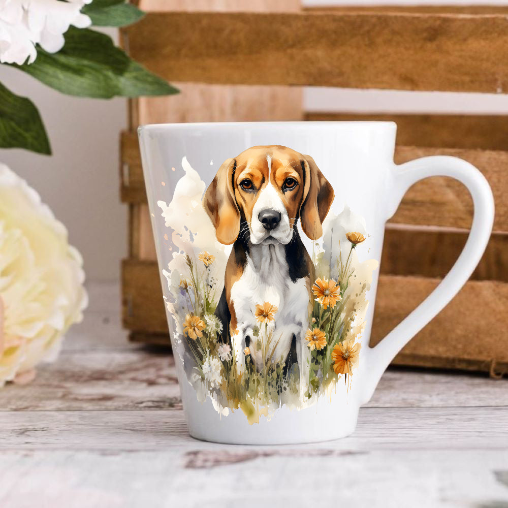 A white ceramic latte coffee mug with an illustration of a beagle dog surrounded by yellow flowers, displayed on a wooden surface.