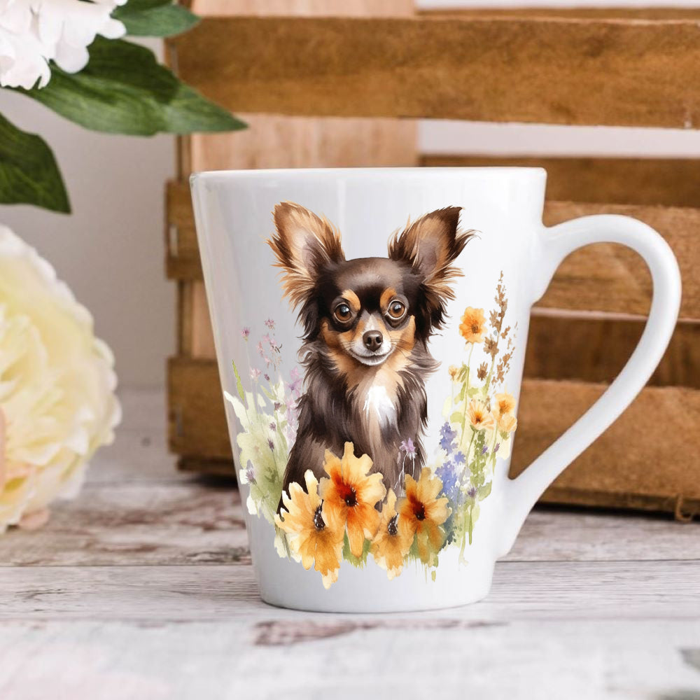 A ceramic latte mug with a colourful illustration of a Chihuahua dog surrounded by floral designs on a white background.