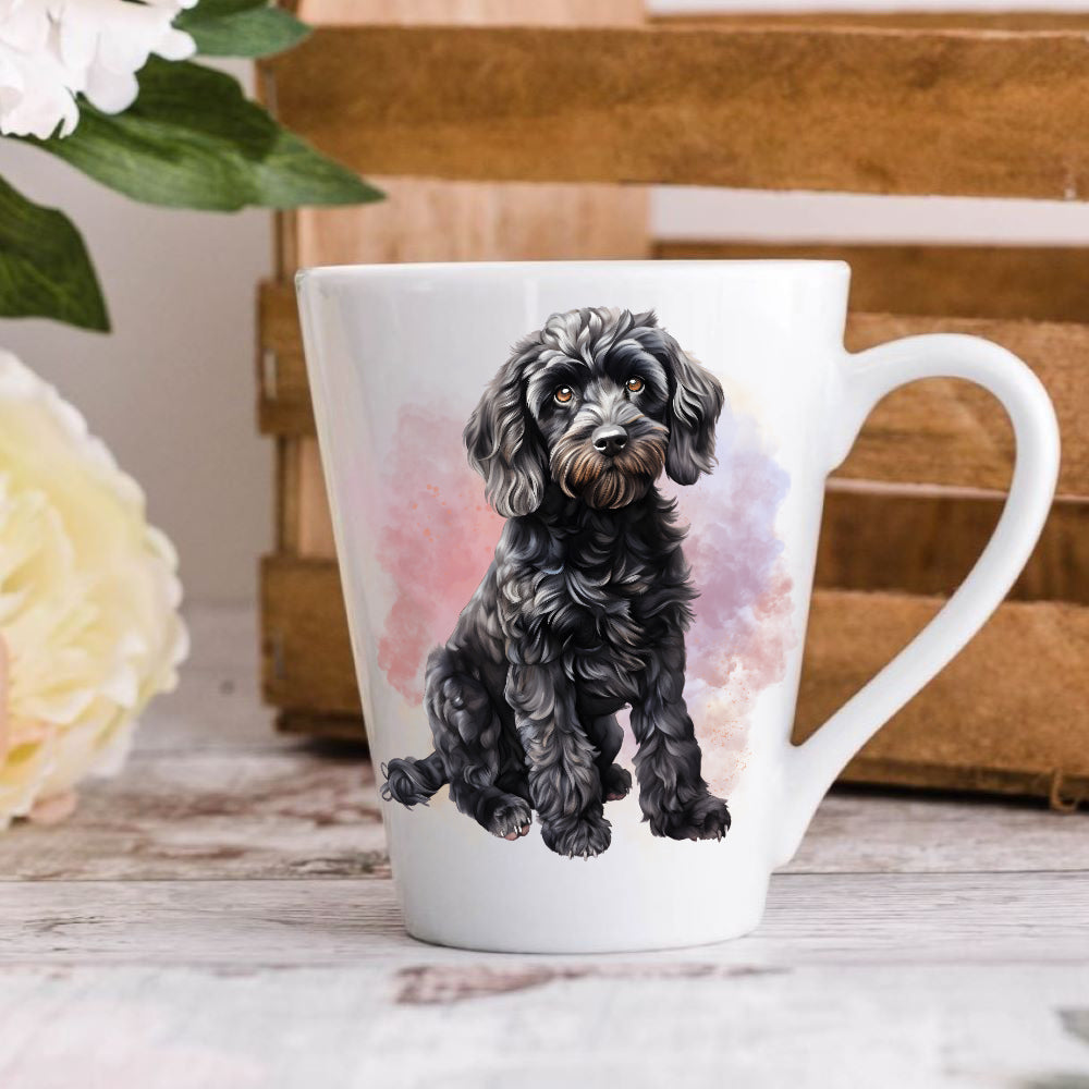 A ceramic mug with a printed image of a black cockapoo dog.