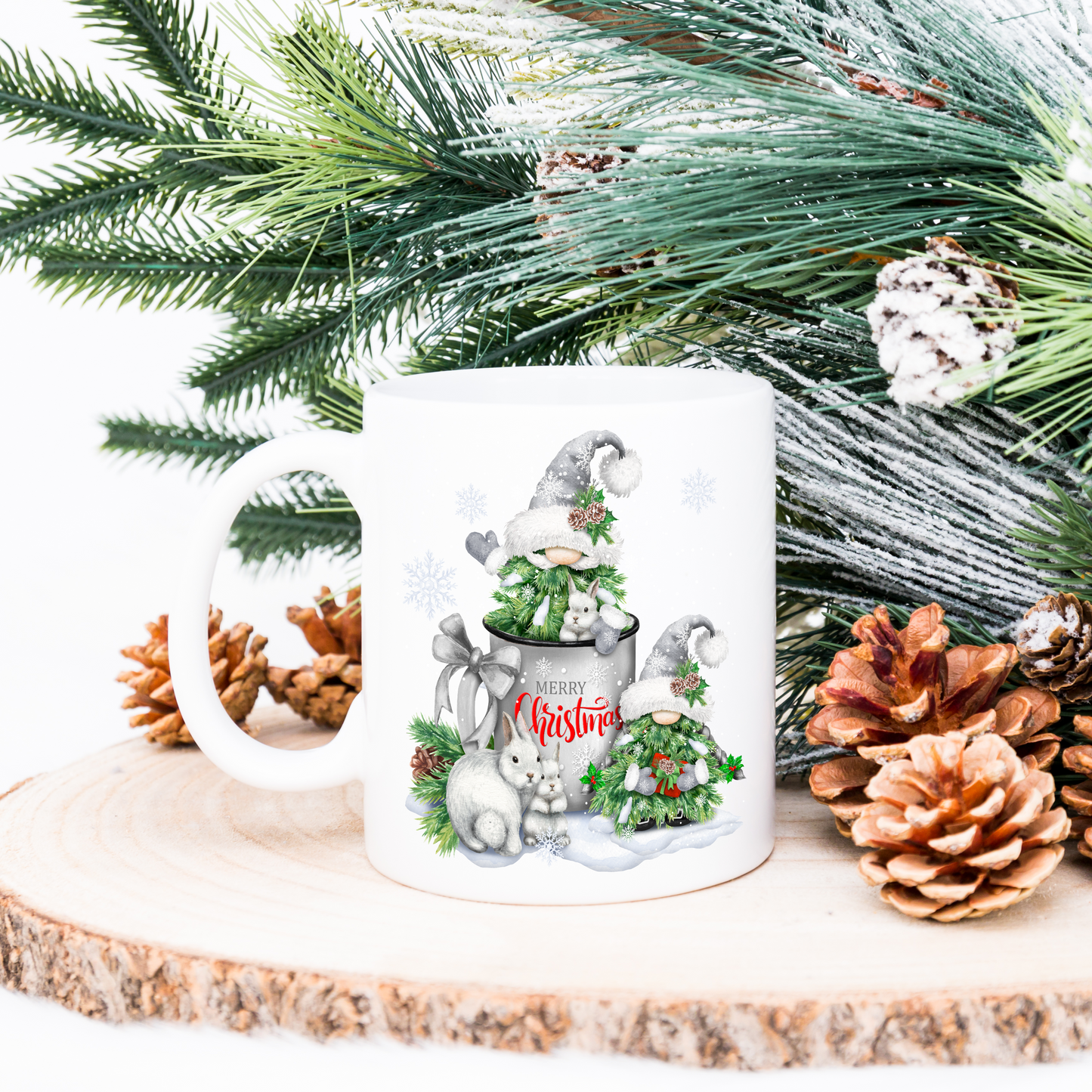 Christmas gnome gift mug. 2 gnomes dressed as Christmas trees. Winter rabbits and snowflakes. Pine cones decorate.
