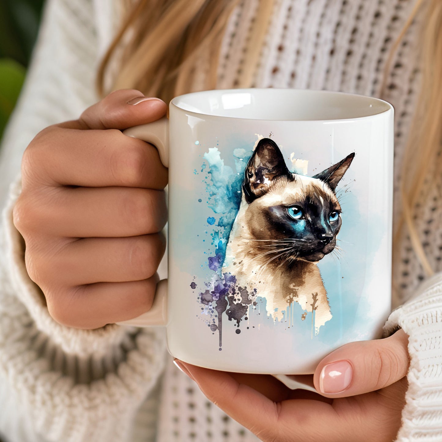 hand held white mug with a siamese cat head and blue smokey background and splash detailing