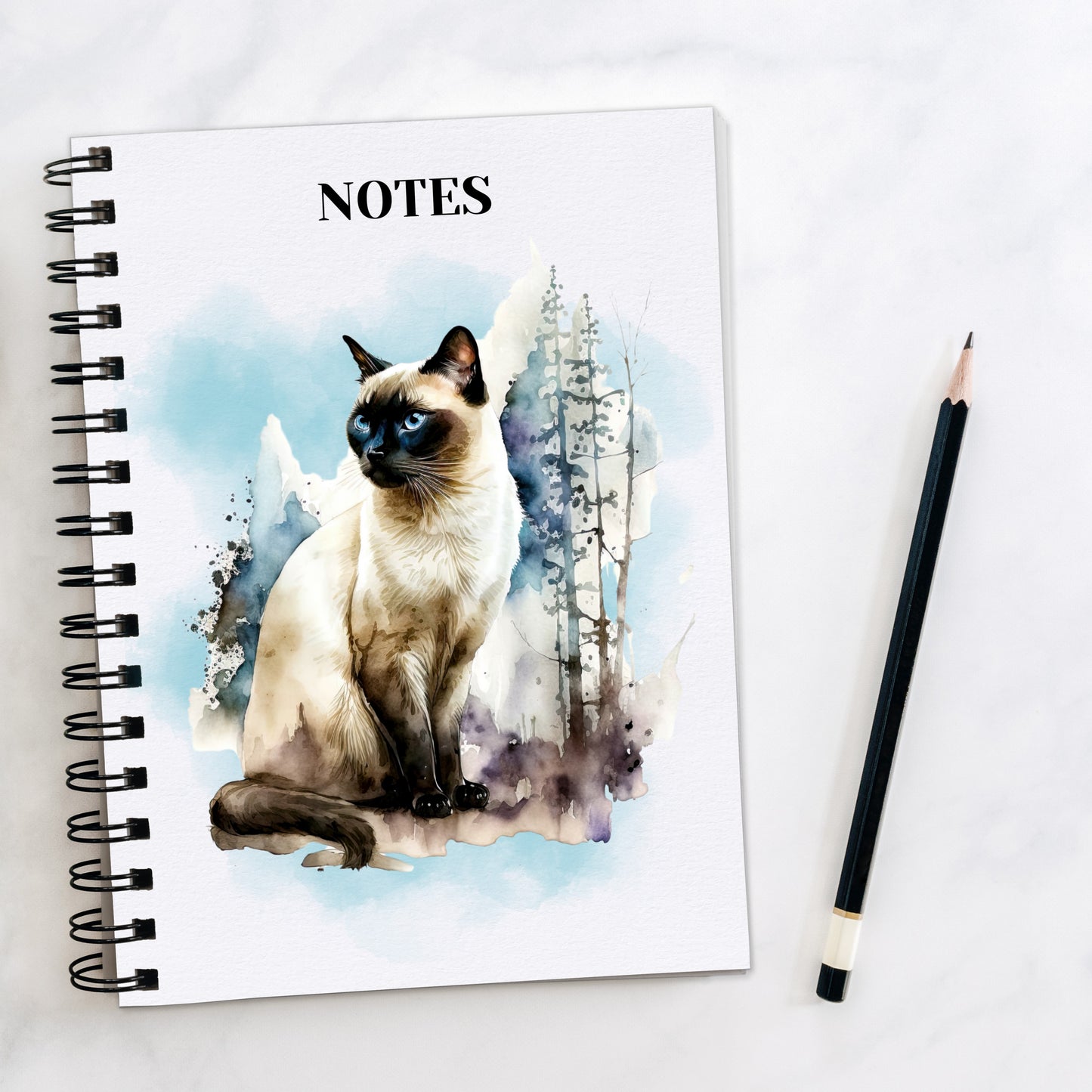 white notebook featuring a sitting siamese cat with a blue background and trees to the side.