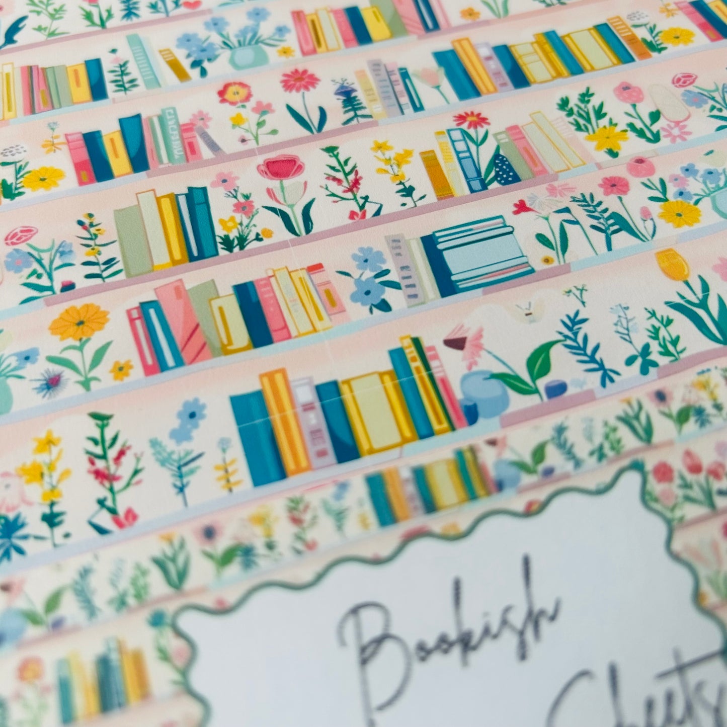 Decorative A4 wrapping sheets with book and floral designs on a white background.