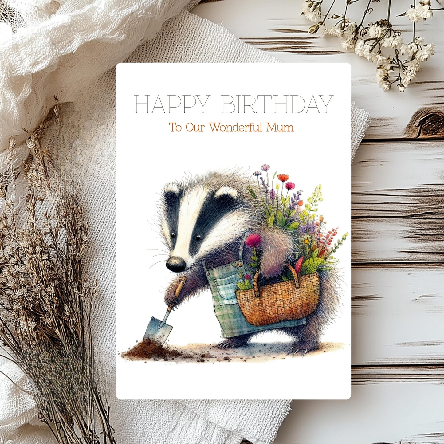 Birthday card with a badger holding flowers on a rustic background