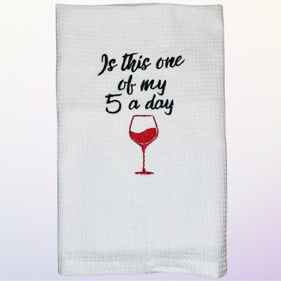 alcohol related gift idea of a tea towel with the slogan "is this one of my 5 a day"
