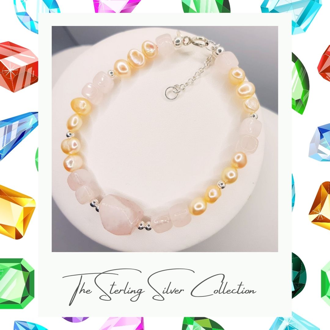 Pretty freshwater pearl bracelet with peach and pink stones on a cream background.
