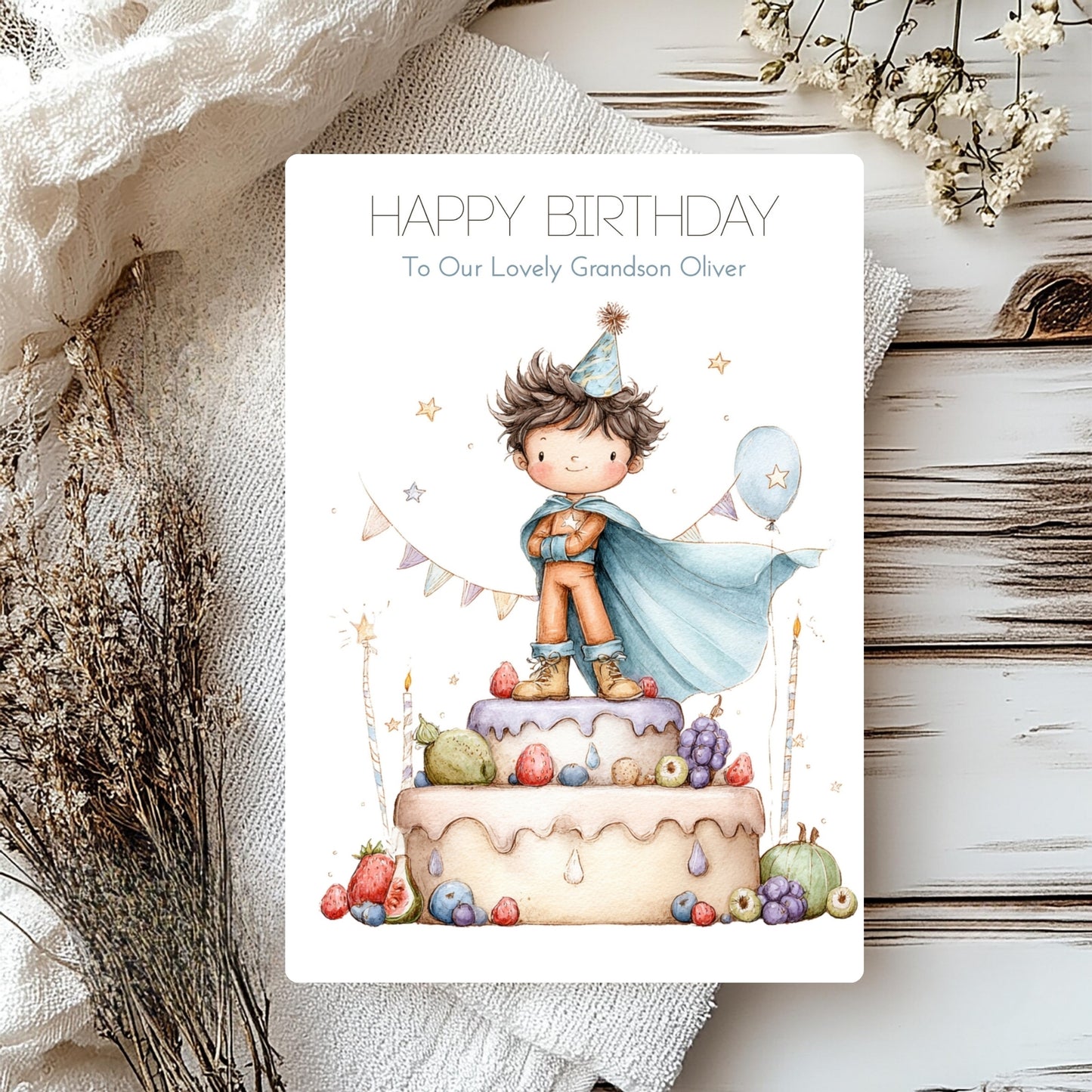 Personalised birthday card with a child on a cake, surrounded by decorative elements.
