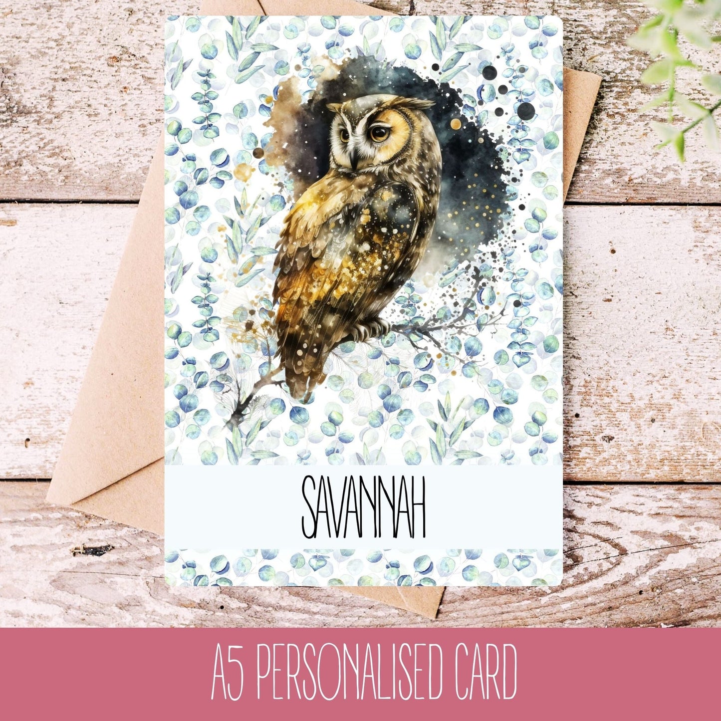 A personalised handmade greeting card with an owl illustration, featuring the name Savannah, on a wooden background.