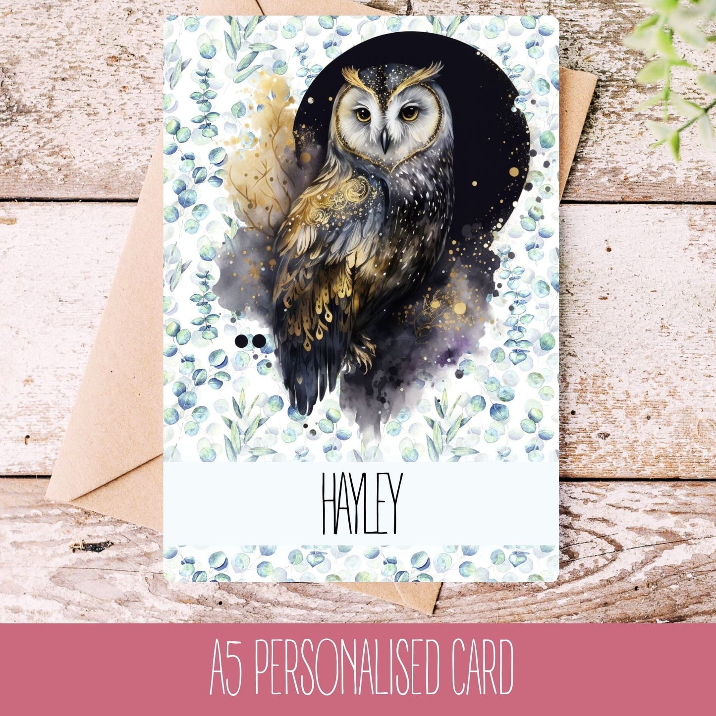 A personalised greeting card with an owl design, featuring the name 'Hayley', set against a rustic background.