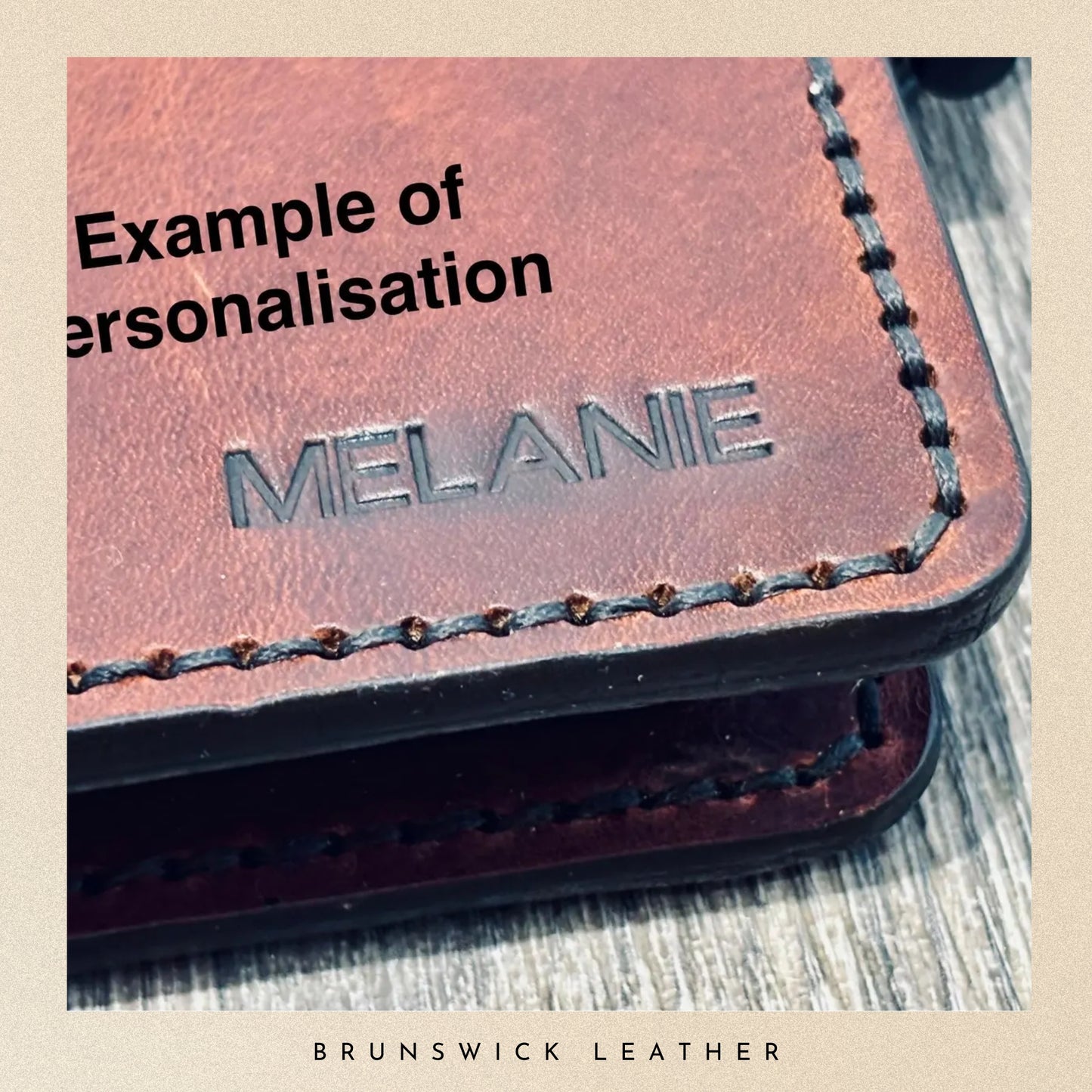 Brown leather product with 'Melanie' engraved, on a wooden surface, branded 'Brunswick Leather'.