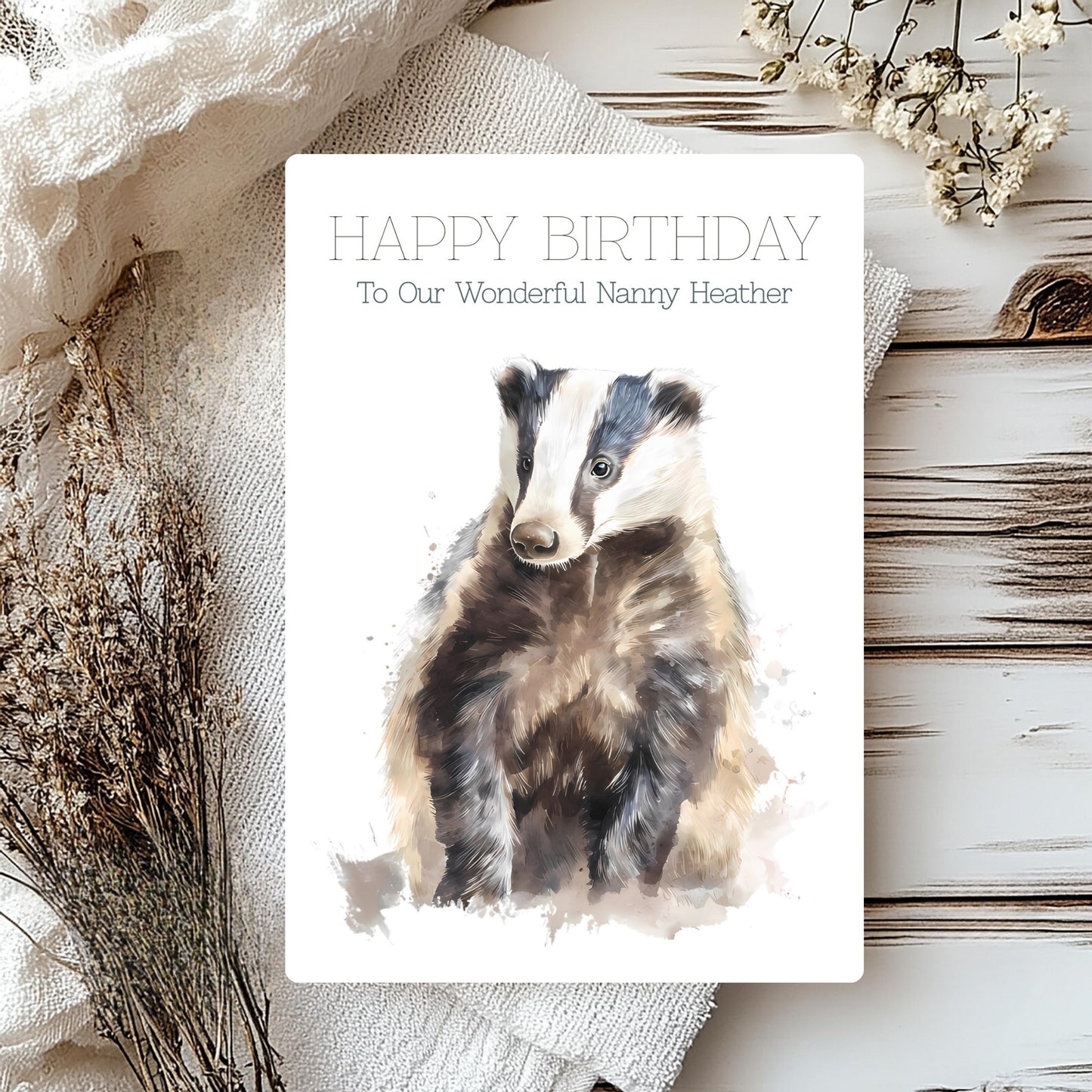 Birthday card with a badger illustration and text on a rustic background