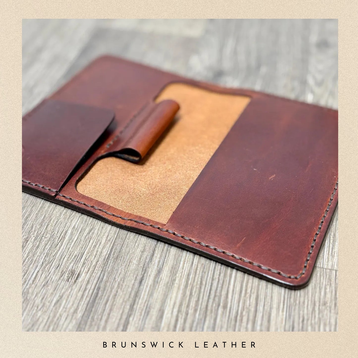 Brown leather wallet on a wooden surface with 'Brunswick Leather' branding.