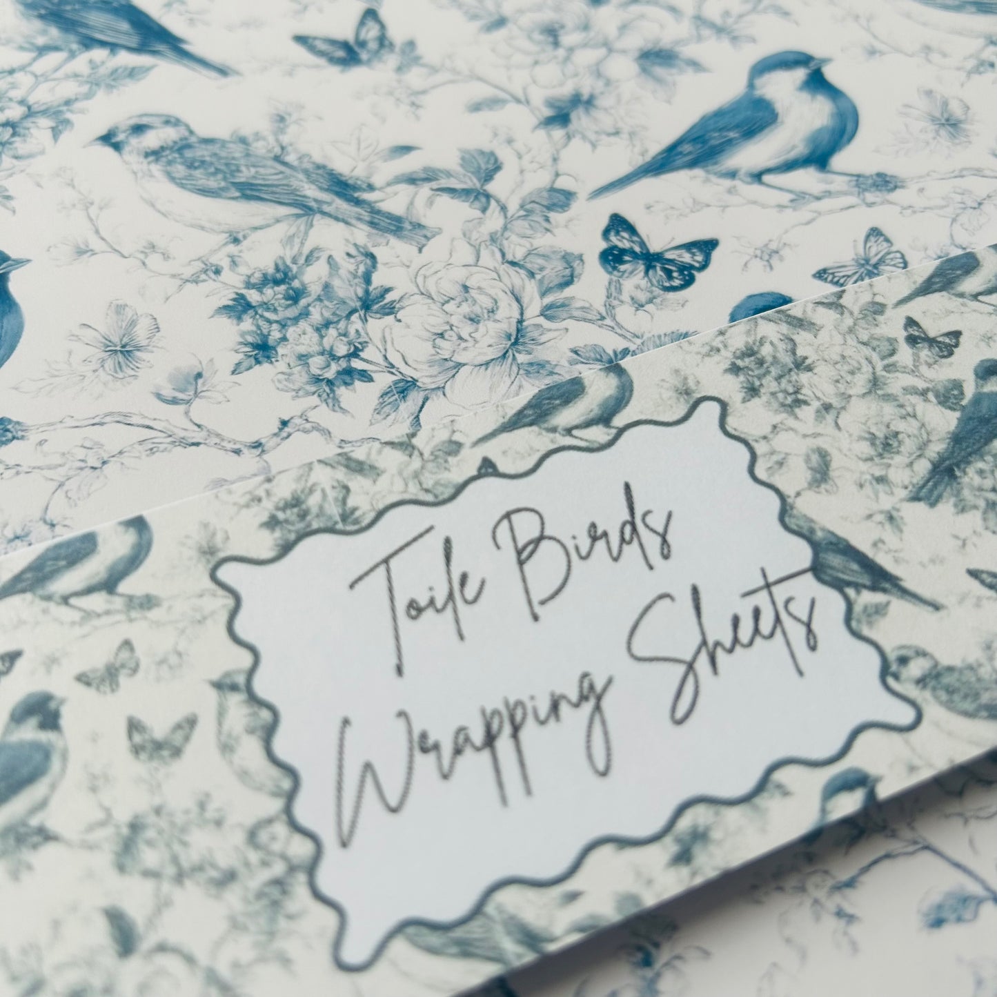 Birds and floral patterned wrapping paper with 'Toile Birds Wrapping Sheets' label.