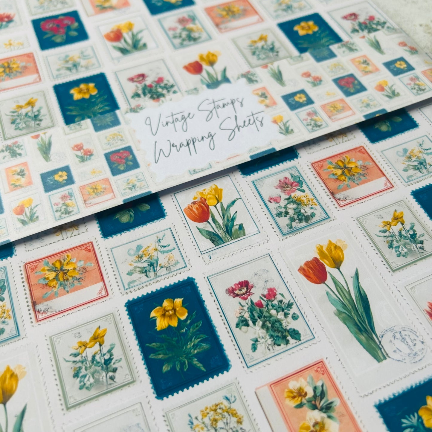 Vintage-style floral stamps on a wrapping sheet with 'Vintage Stamps' text.