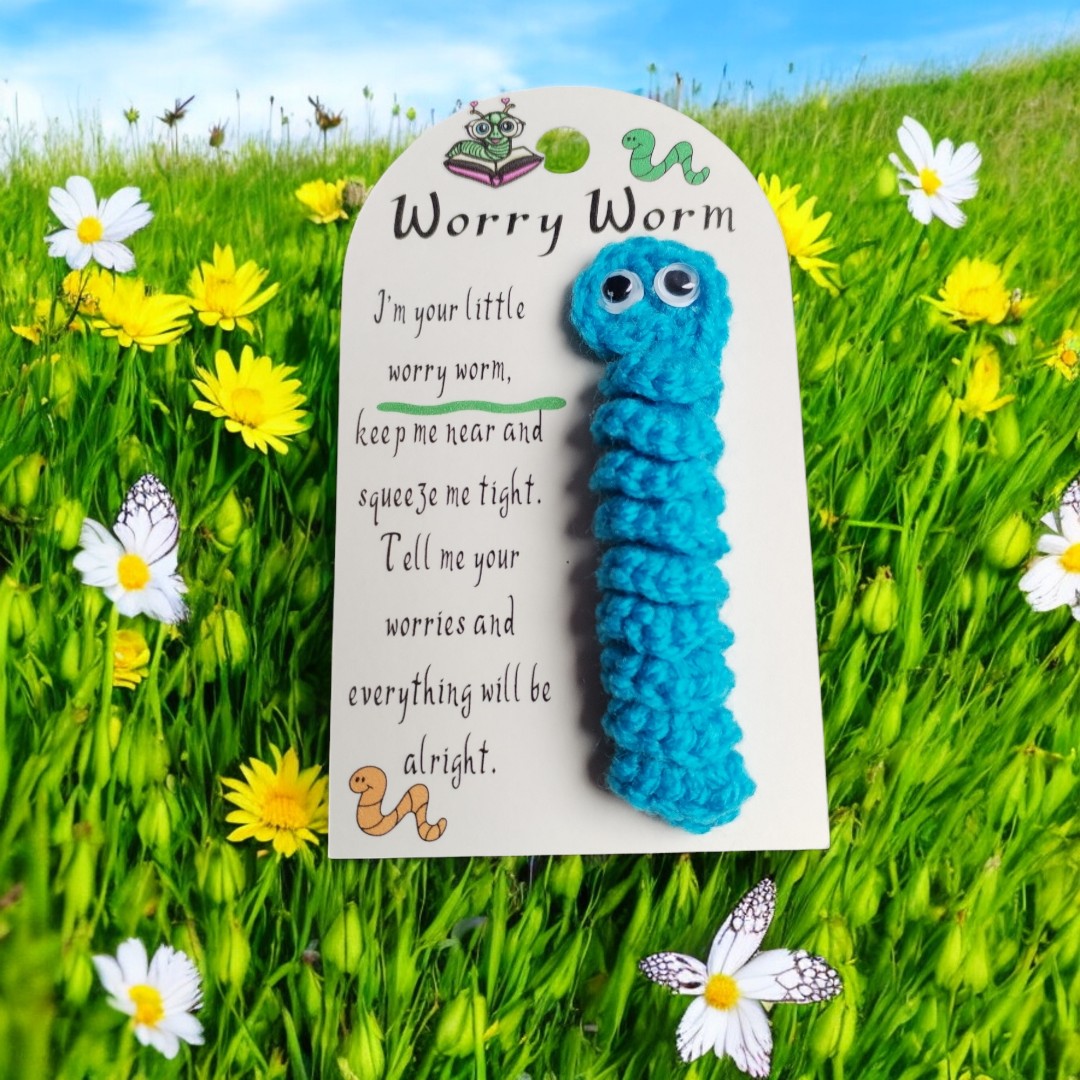 Blue worry worm  with a poem on a grassy background
