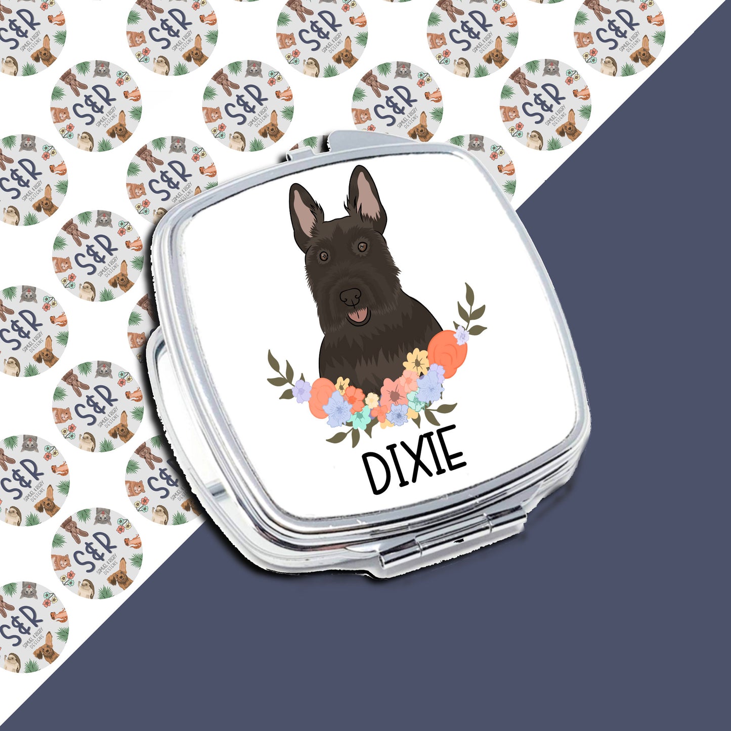 A personalised compact mirror with a Scottish Terrier dog illustration and a floral border on a white background.