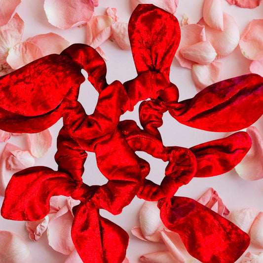 A collection of velvet hair bows in black, red, yellow, and green, displayed on a white background with the brand name 'Colledge Creations'.