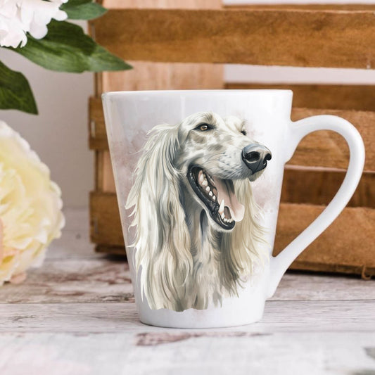 A latte coffee mug with a watercolor design of an Afghan Hound dog, placed on a wooden surface with a floral pattern in the background.