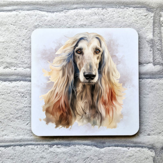A head shot of an Afghan Hound with long flowing hair sat facing forward. A smoky background decorates the image on a white drinks coaster. The coaster is placed on a grey, brick effect surface.