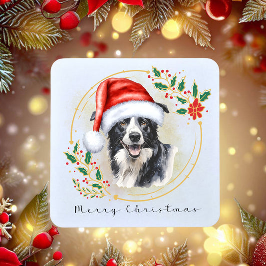 Border Collie in a Santa Hat on a Christmas themed coaster, surrounded by Christmas tree branches and berries.