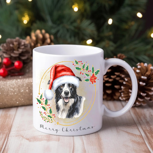 Border Collie wearing a Santa hat on a white ceramic Christmas themed mug positioned in front of a Christmas tree and gifts.