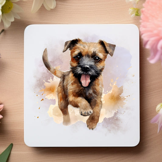 White coaster featuring a printed image of a running Border Terrrier on a smokey background.  Coaster is placed on a wooden surface.