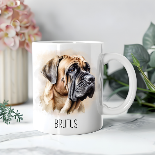 Personalised coffee mug featuring a Bullmastiff on a white ceramic mug which has been placed on white surface. A large pink flower sits to the left with dark green foliage on the right to accessorizes the image.