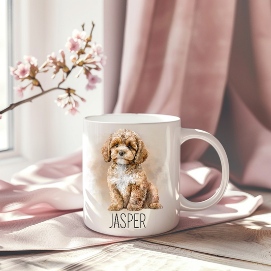 Cavapoo in a sitting position with a smoky background on a white ceramic mug which has been placed on a pink drape.  A stem of small pink flowers accessorizes the image.