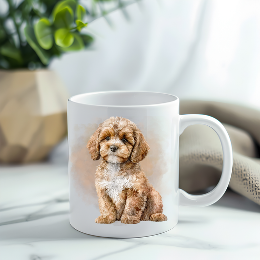 A Cavapoo in a sitting position on a white ceramic mug which has been placed on a grey marble surface. A plant decorates the left corner.