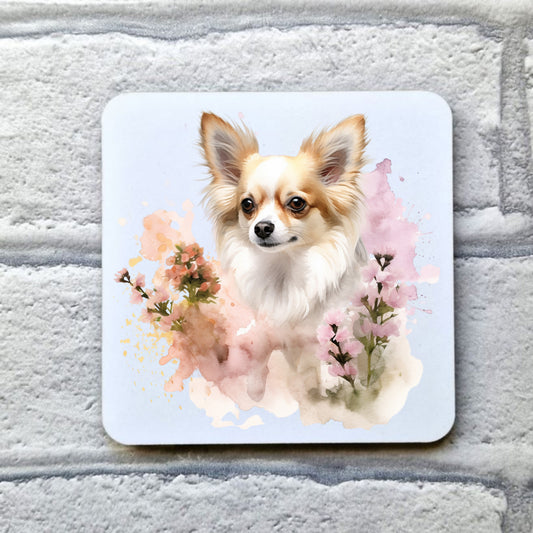 White coaster featuring a printed image of a Chihuahua sat among flowers.  Coaster is placed on a grey brick surface