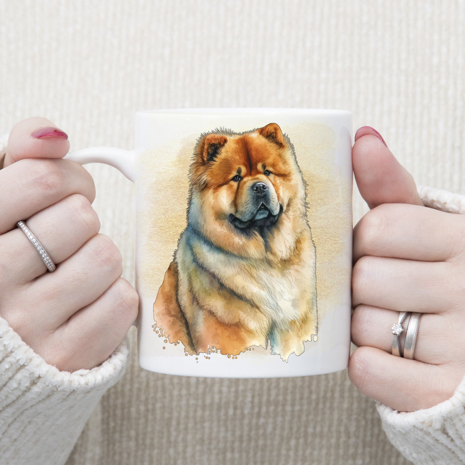 White ceramic mug with an image of a Chow Chow.  A golden misty background decorates. The mug is being held by a woman with both hands.