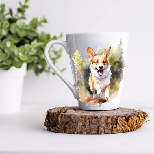 A white ceramic latte mug with a colourful illustration of a Corgi dog on it, displayed on a wooden stand with a green plant in the background.