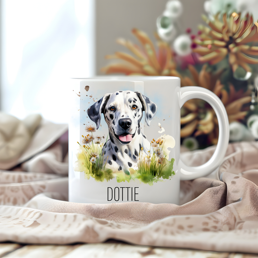 Personalised coffee mug featuring a Dalmatian in the grass on a white ceramic mug which has been placed on a beige cloth.  Stems of large  flowers accessorizes the image.