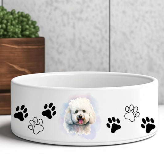 Bichon-frise with it's tongue out on a pionk and blue smoky background adorn a white dog bowl.