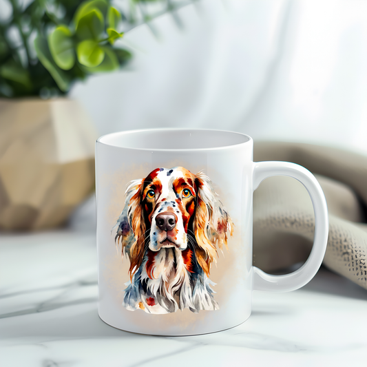 English Setter headshot on a white ceramic mug which has been placed on a grey marble surface.  A plant decorates the left corner.