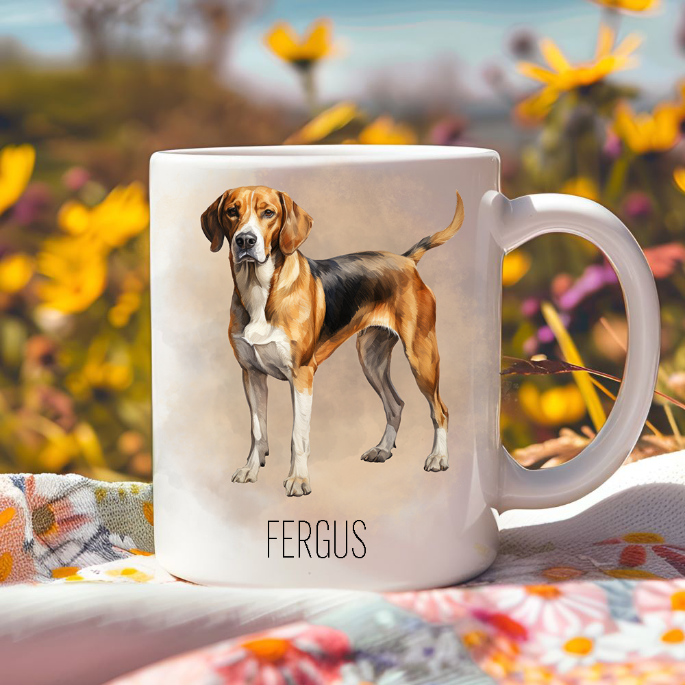 Bright yellow flowers surround this lovely personalised ceramic mug showing a Foxhound.  The mug is placed on a floral multicoloured tablecloth.
