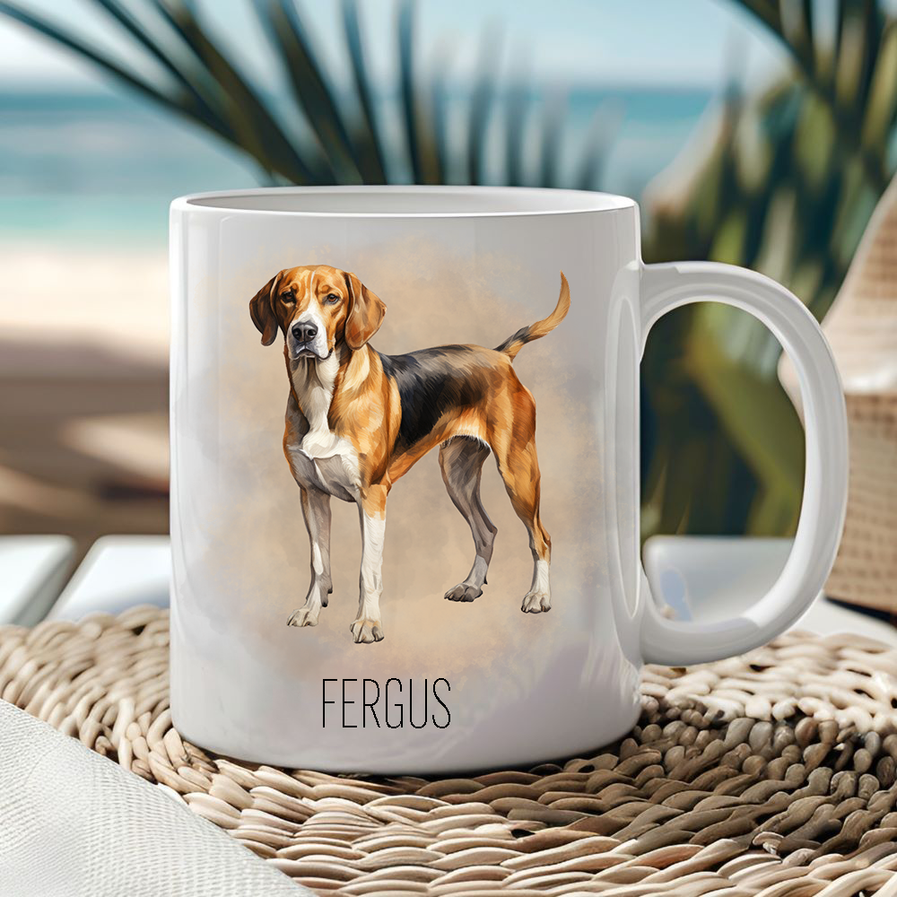 White ceramic mug showing a Foxhound on a smoke effect background.  Mug is placed on a wicker mat and an ocean scene is behind.