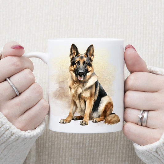 White ceramic mug with a German Shepherd dog sitting. The mug is being held by a woman with both hands.
