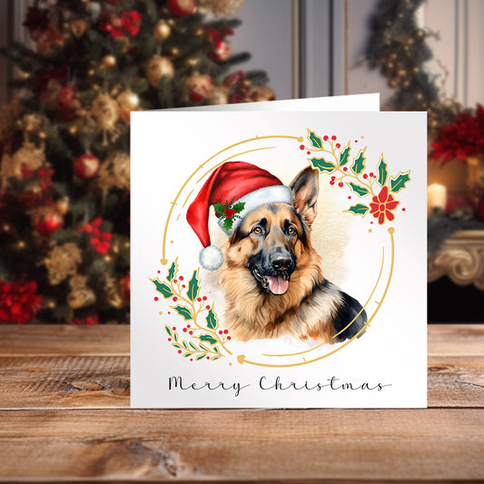 German Shepherd Wearing a red Santa hat on a Christmas themed card. Decorated Christmas tree in the background.