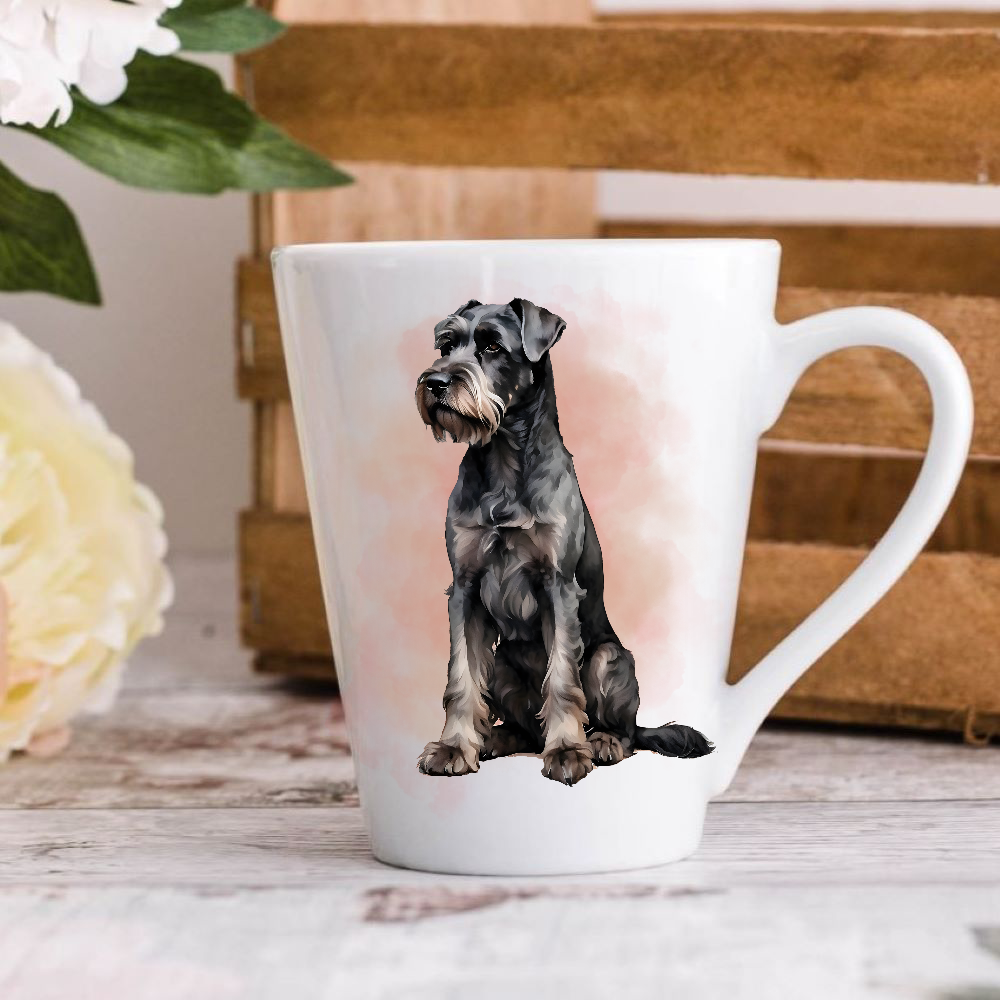 A white ceramic latte mug stands on a wooden surface with a crate in the background. The mug features a Giant Schnauzer dog.  A large yellow flower peeps in from the left-hand side.