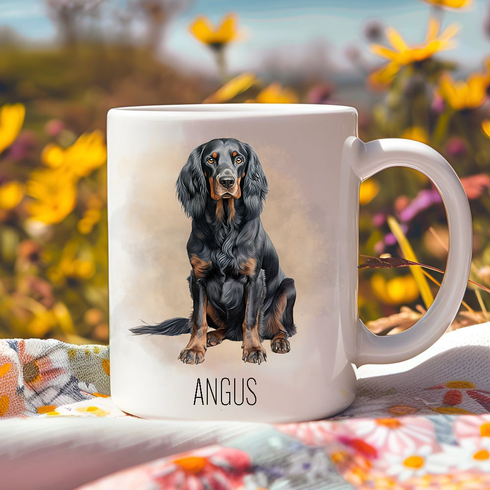 Bright yellow flowers surround this lovely personalised ceramic mug depicting a seated Gordon Setter.  The mug is placed on a floral multicoloured tablecloth.