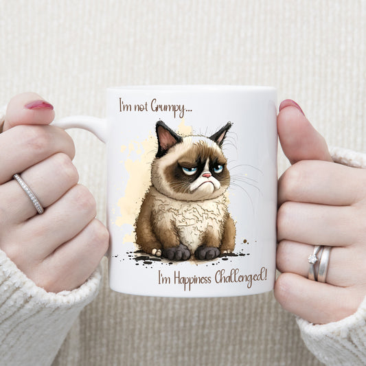 White ceramic mug with an image of Grumpy Cat and a quote. Grumpy face with brown markings and blue eyes.
