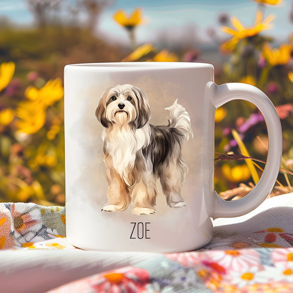 Bright yellow flowers surround this lovely personalised ceramic mug depicting a gorgeous Havanese dog facing forward.  The mug is placed on a floral multicoloured tablecloth.