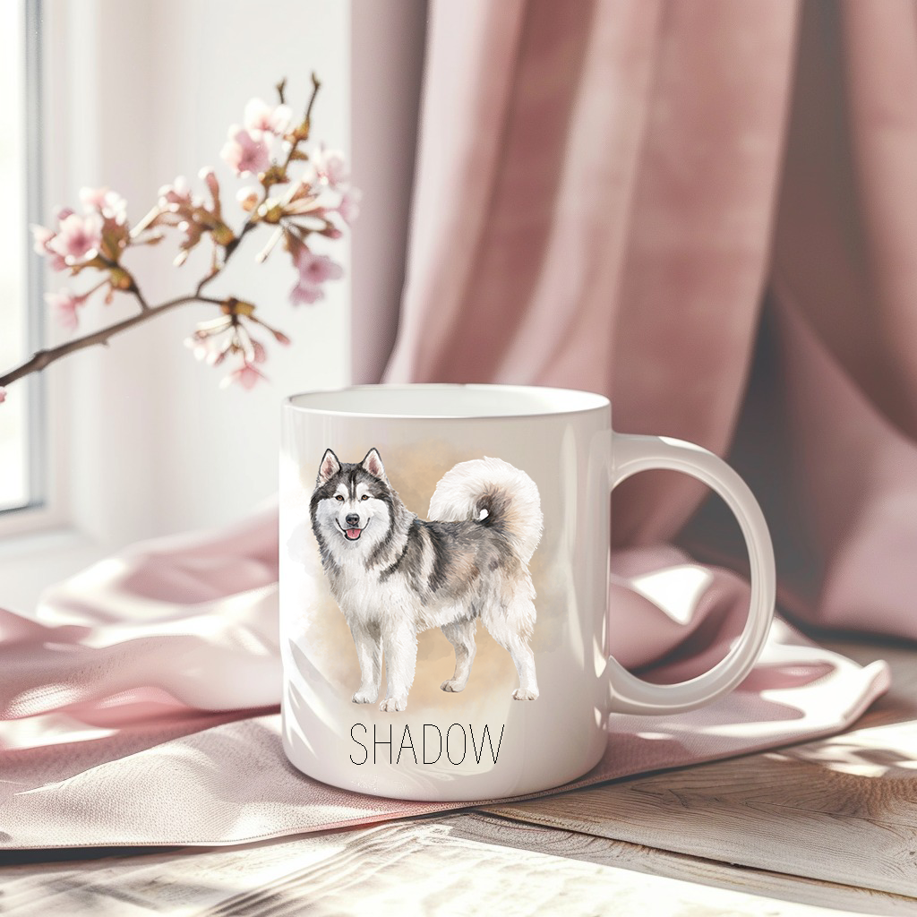 A Husky is standing on a personalised white ceramic mug which has been placed on a pink drape.   A stem of small pink flowers accessorizes the image.