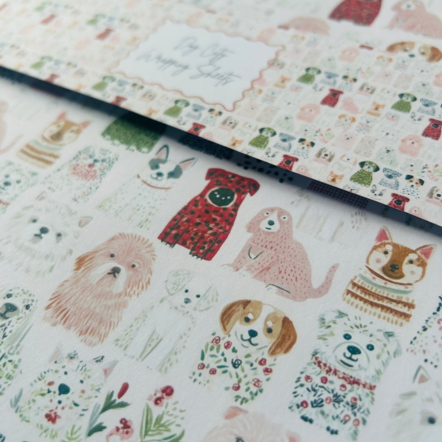 Patterned paper with illustrations of dogs and flowers on a white background