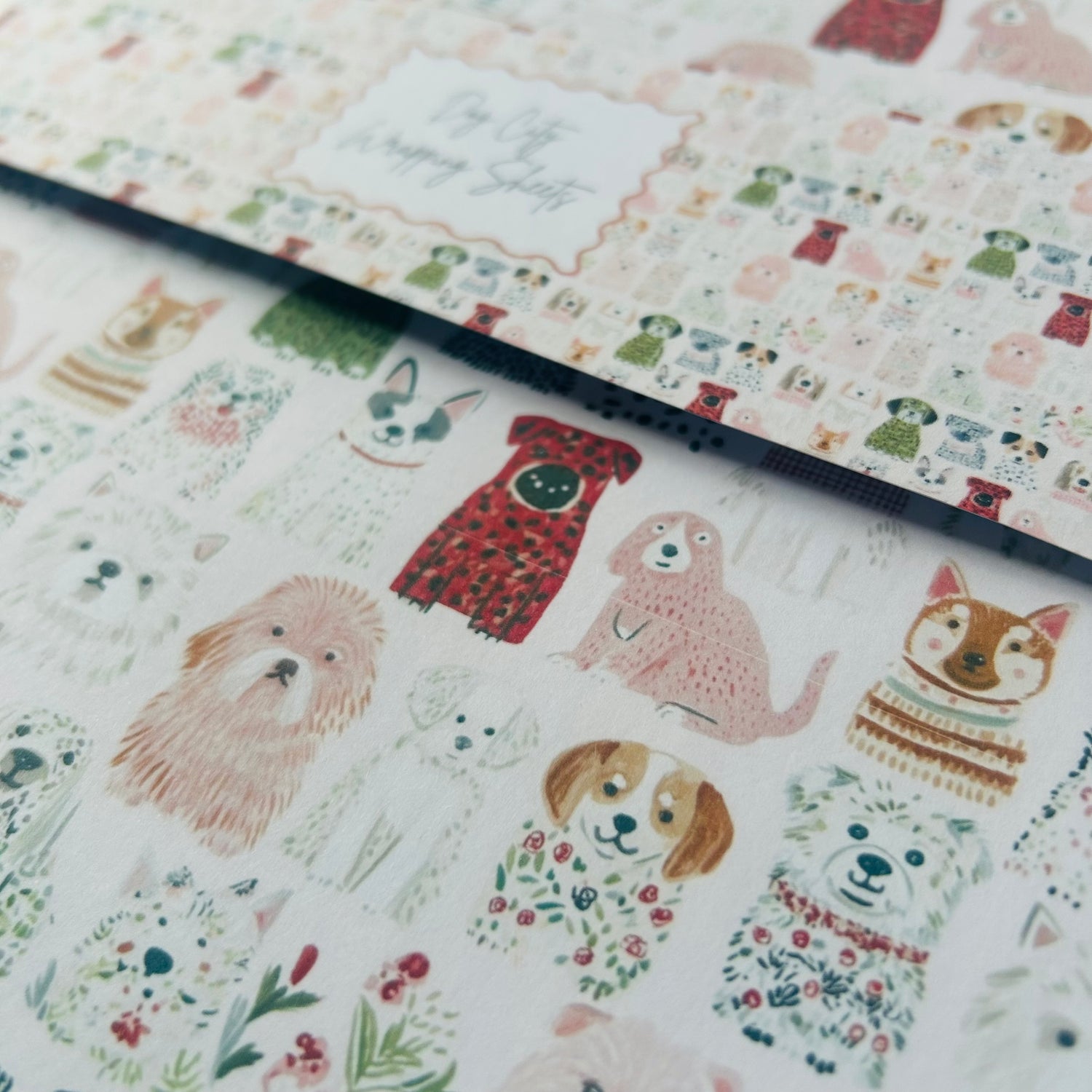 Patterned paper with illustrations of dogs and flowers on a white background