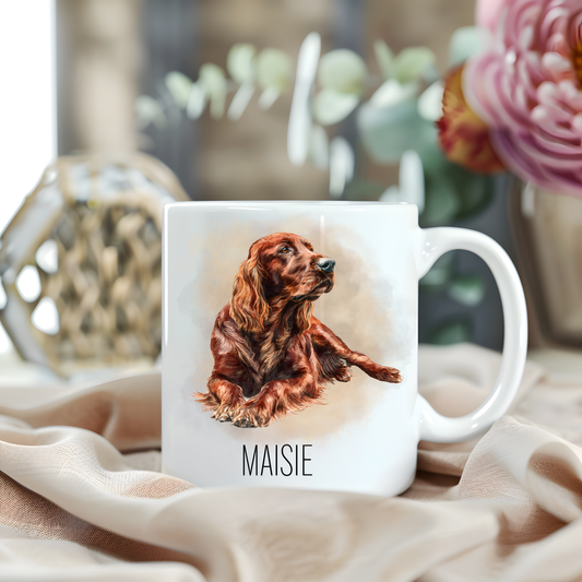 An Irish Setter is laid looking to the right on a white personalised ceramic mug which has been placed on a beige cloth. A large pink flower with green foliage accessorizes the image.
