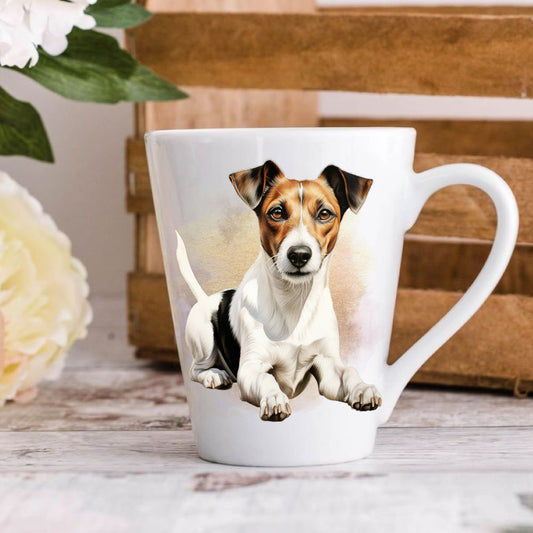 A 12oz white ceramic latte mug with a printed vibrant image of a Jack Russell Terrier dog, positioned on a wooden surface with a blurred background.