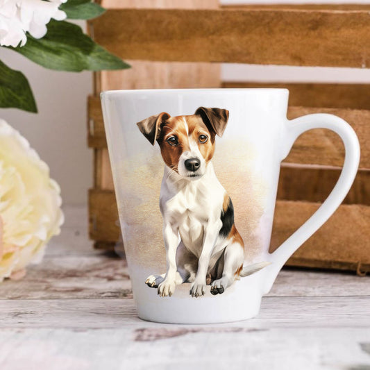 A 12oz white ceramic latte mug with a printed image of a Jack Russell Terrier dog, positioned on a wooden surface with a blurred background.