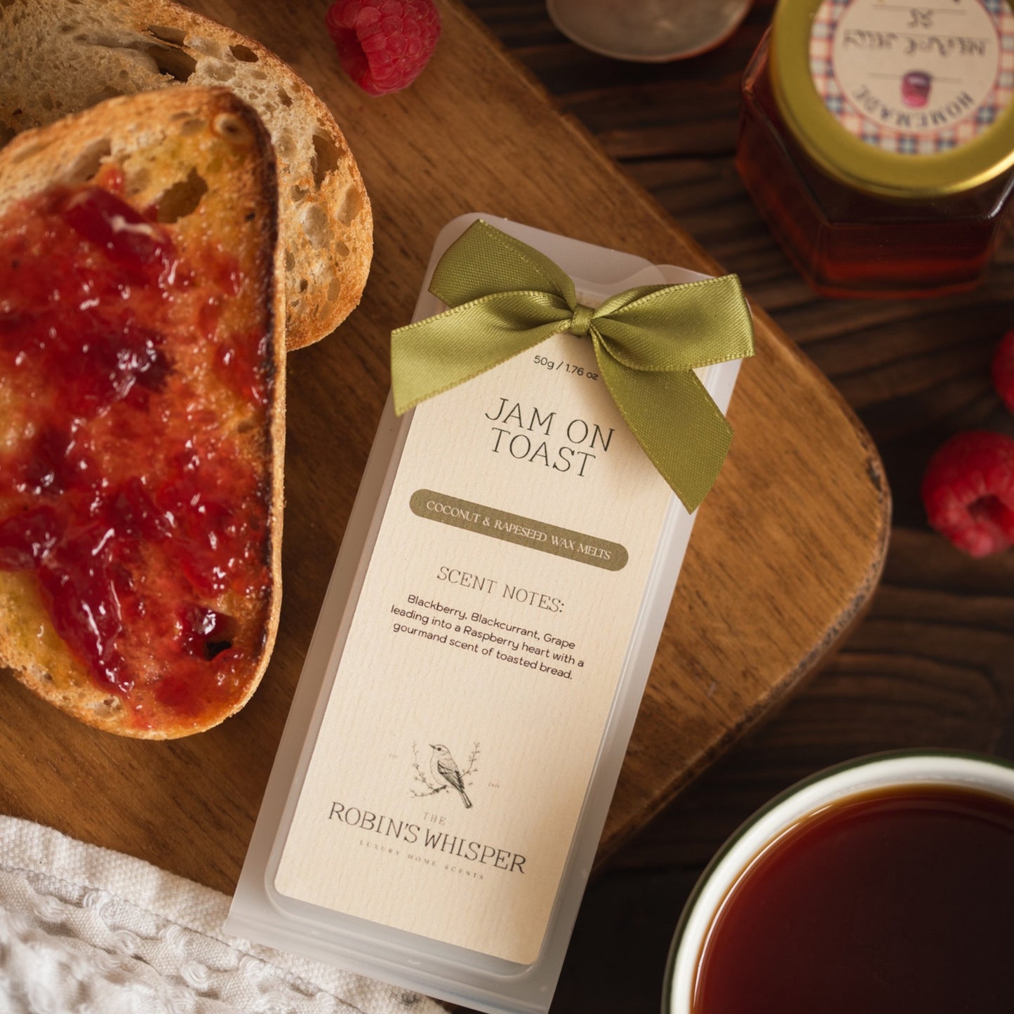Jam on toast wax melts shown on a board with slices of bread with jam on.